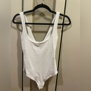 Designer ALIX NYC white bodysuit. Easy to wear with anything. Never worn.